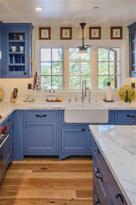 blue kitchen cabinets white countertop.